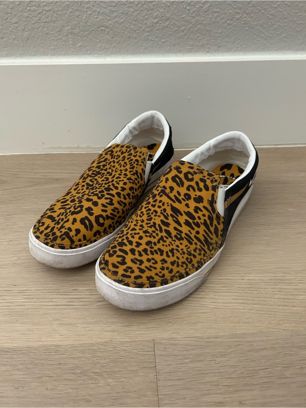Nike Leopard-Print Slip-On Sneakers in Gold and Black